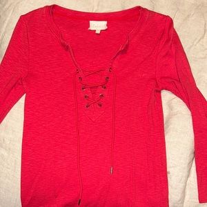 Anthropologie red lace up too by brand Deletta